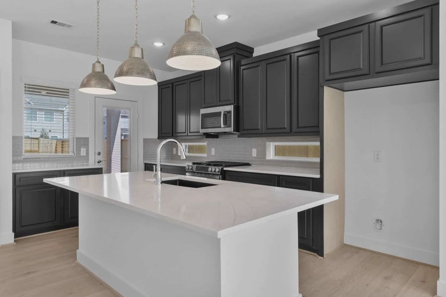 Representative furnished interior of a home built from the Riverdale by Chesmar Homes in Meridiana Courtyard Collection, Manvel (Image 5).
