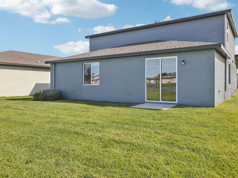 Exterior details and patio area of a home in The Grove at Stuart Crossing - Classic Series, Bartow (Image 3).