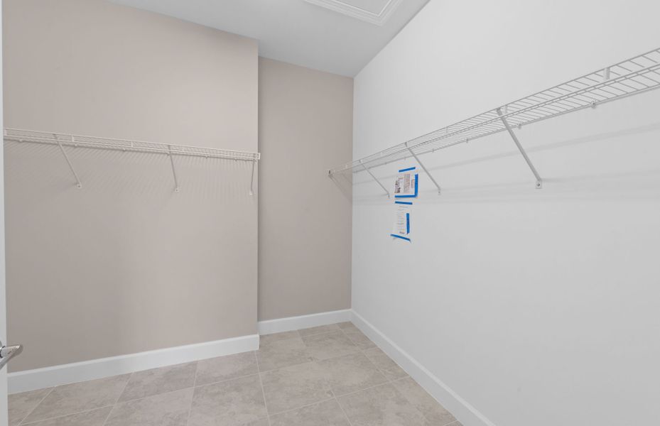 Spacious walk-in closet in owner's bath