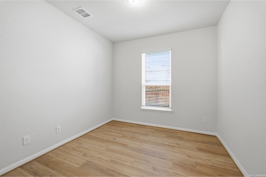 Spacious, unfurnished interior of a new home in The Woodlands at Medina Hills, Mico (Image 18).