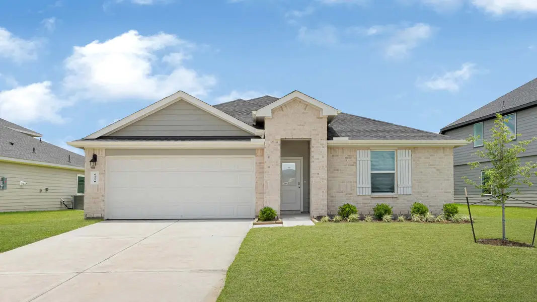 Front exterior of a new home in Evergreen, Rosenberg, TX, highlighting curb appeal (Image 1). Front exterior of a new home in Evergreen, Rosenberg, TX, highlighting curb appeal (Image 1).