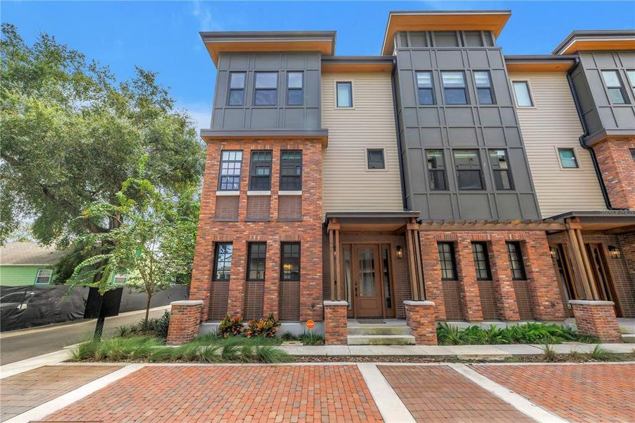 Front exterior of a new home in East Oak Townhomes, Tampa, FL, highlighting curb appeal (Image 23).