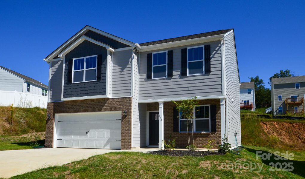 Front exterior of a new home in Rydele Heights, Asheville, NC, highlighting curb appeal (Image 1). Front exterior of a new home in Rydele Heights, Asheville, NC, highlighting curb appeal (Image 1).