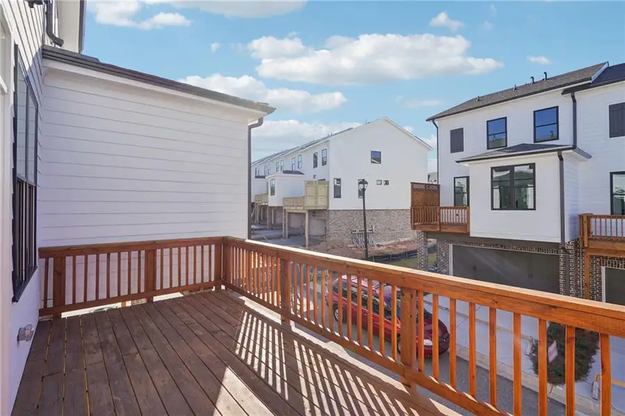 Exterior details and patio area of a home in Palisades Townhomes, Cumming (Image 19).