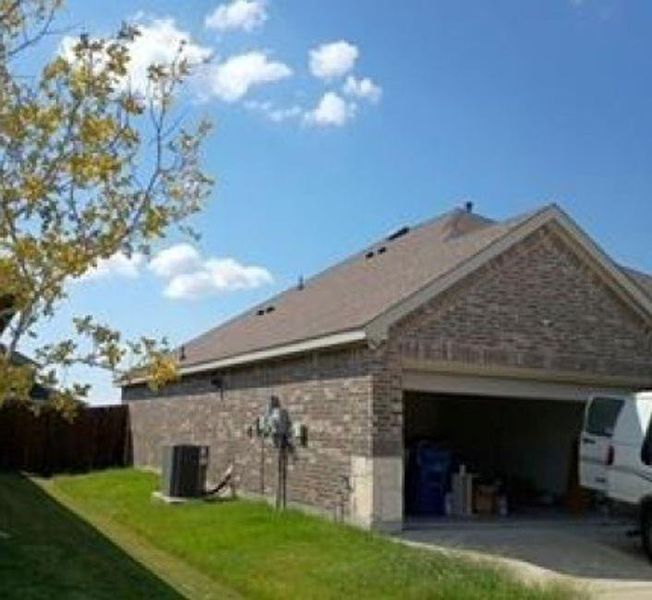 Exterior details and patio area of a home in Winchester Crossing, Princeton (Image 2).