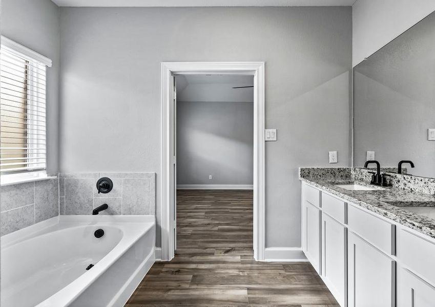 The master bathroom has his-and-hers sinks and plenty of counter space!