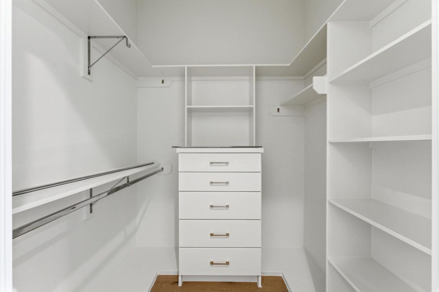 Walk-in closet for secondary bedroom.