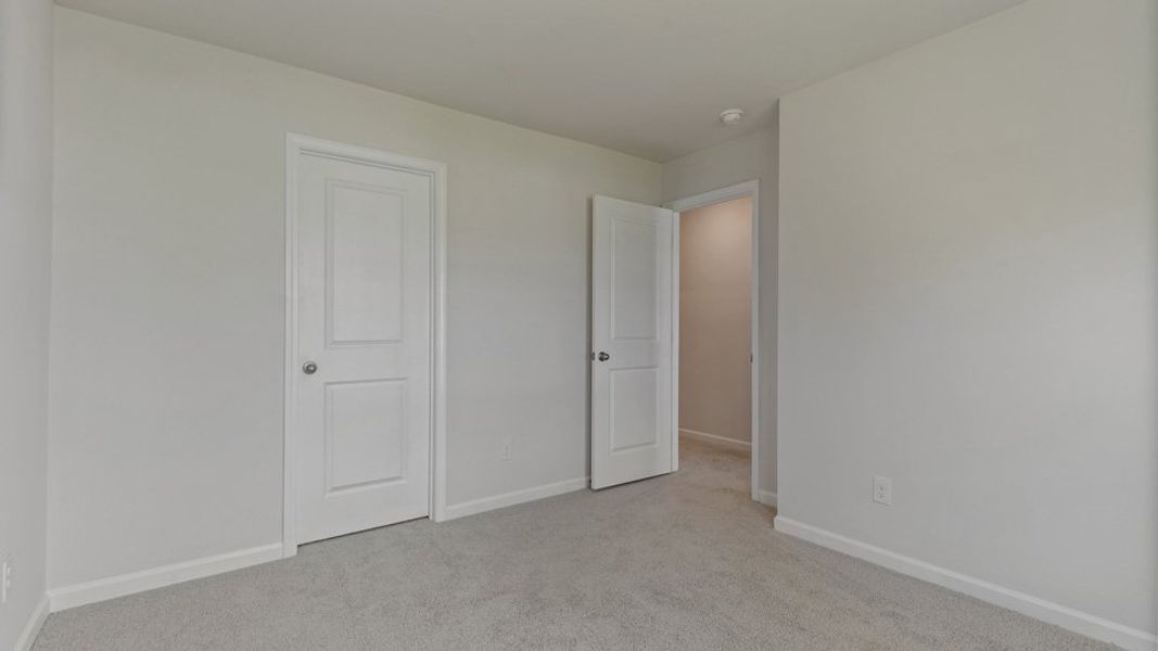 Representative unfurnished interior of a home built from the LANSING - TRADITIONS by D.R. Horton in Chapel Townes, Raleigh (Image 24).