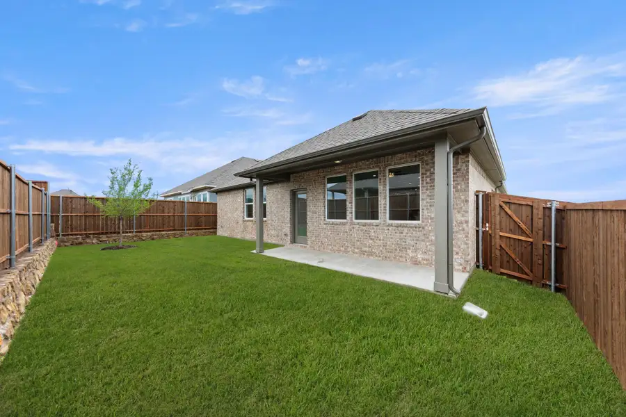 Exterior details and patio area of a home in Creekside, Royse City (Image 3).
