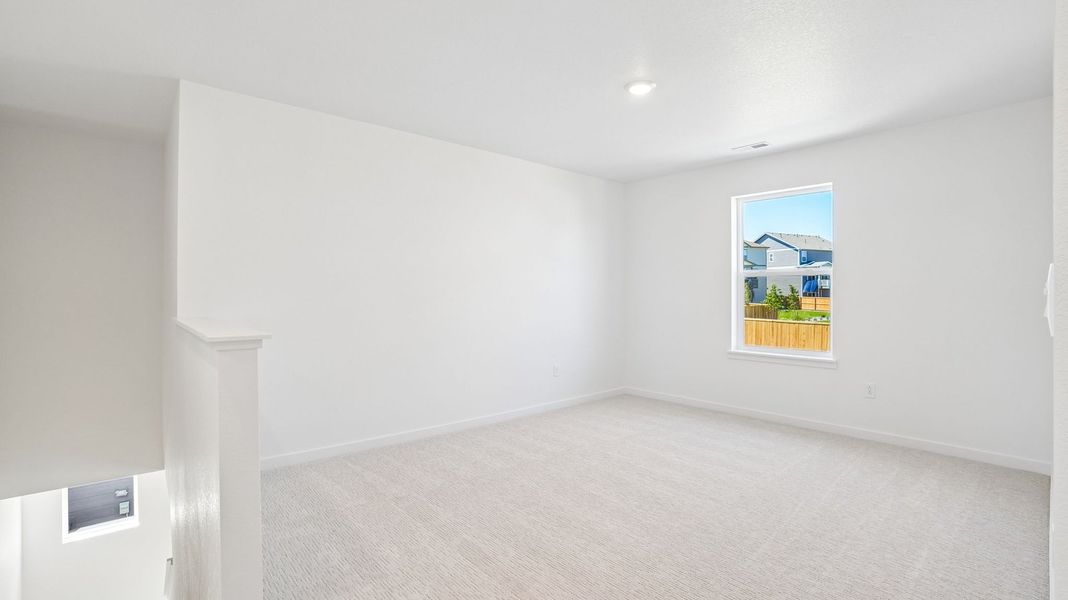 Spacious, unfurnished interior of a new home in Trails at Crowfoot, Parker (Image 13).