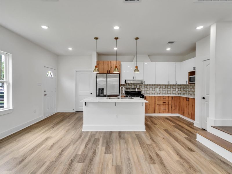 Kitchen island with recessed cams and pendant lighting. Kitchen island with recessed cams and pendant lighting.