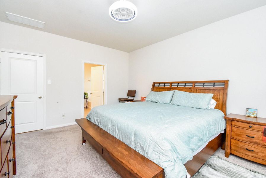 Spacious primary bedroom conveniently located on the first floor. Spacious primary bedroom conveniently located on the first floor.
