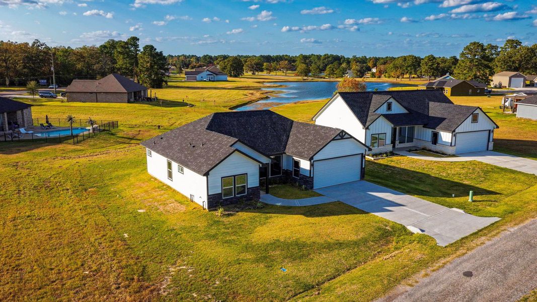Front exterior of a new home in , Trinity, TX, highlighting curb appeal (Image 16).