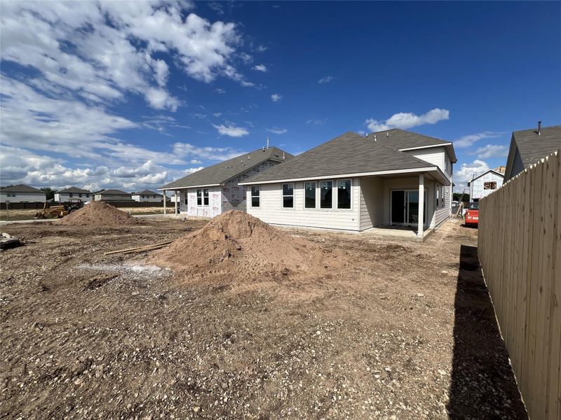 Front exterior of a new home in Rolling Glen, Hutto, TX, highlighting curb appeal (Image 14).