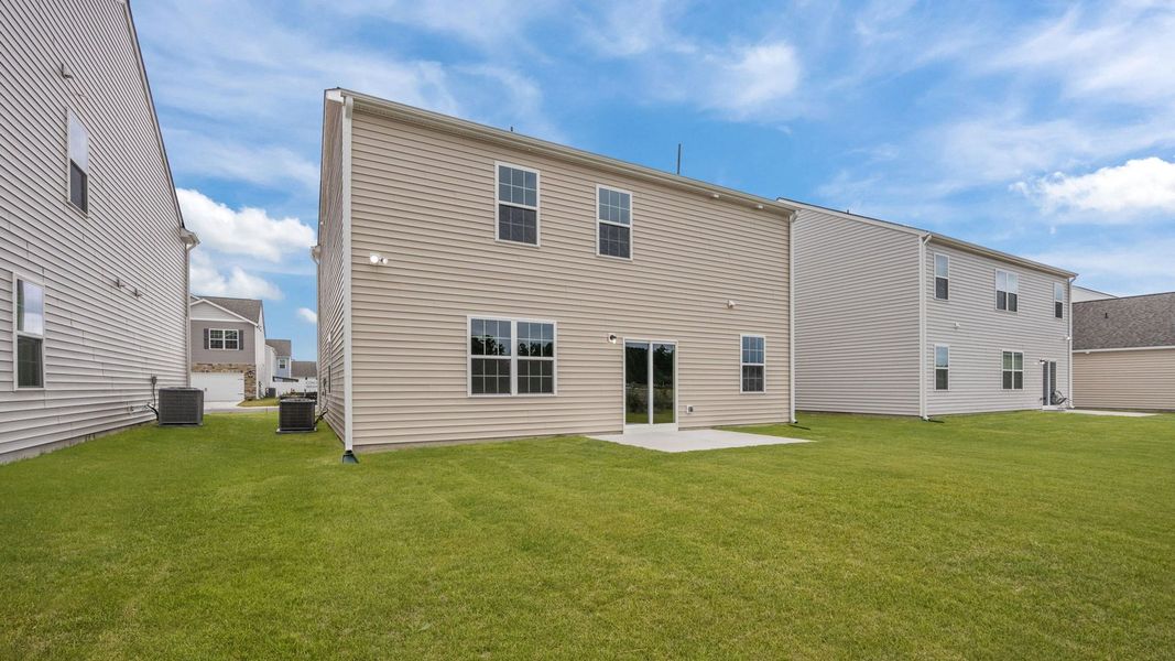 Exterior details and patio area of a home in Ridgewood Farms, Winterville (Image 18).