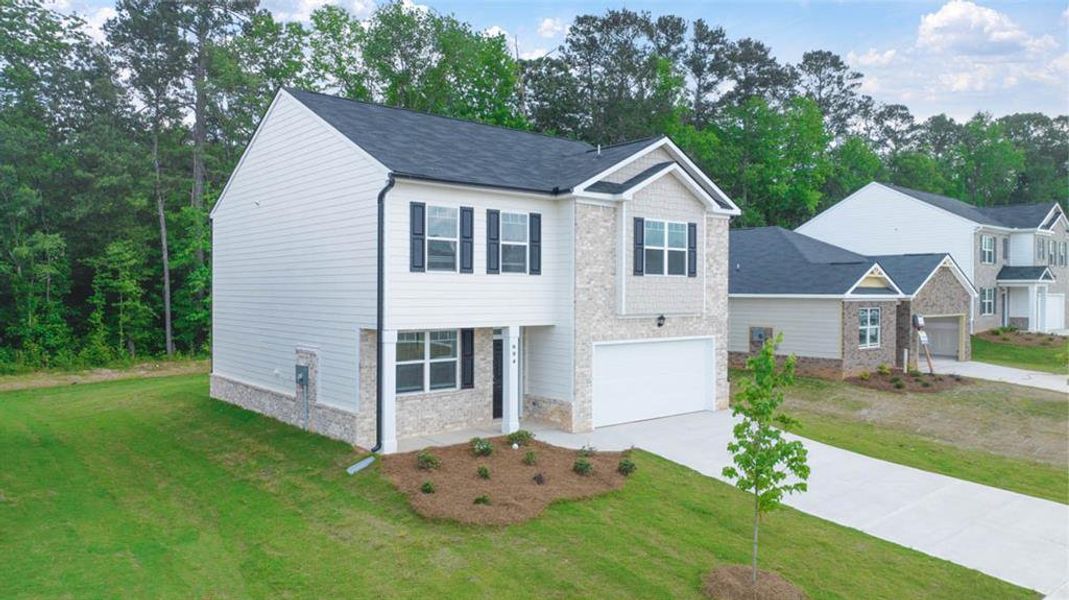 Front exterior of a new home in The Reserve at Calcutta, Stockbridge, GA, highlighting curb appeal (Image 2).