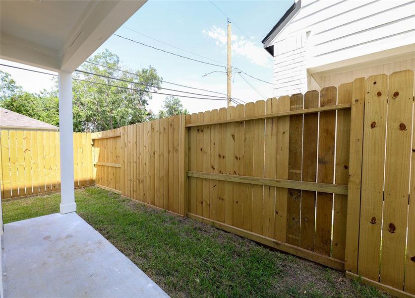 Step outside to your private covered patio and dog run.