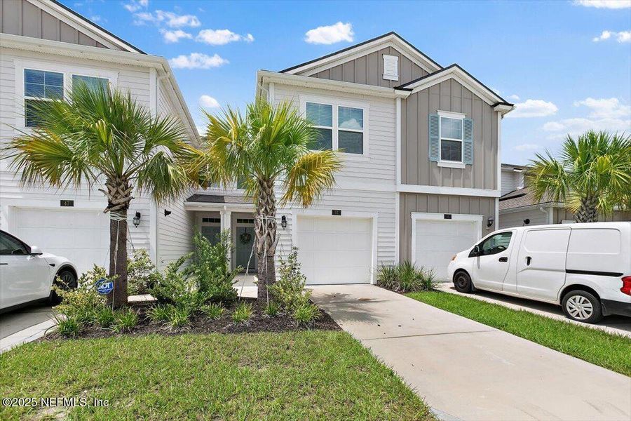 Front exterior of a new home in , St. Augustine, FL, highlighting curb appeal (Image 1).