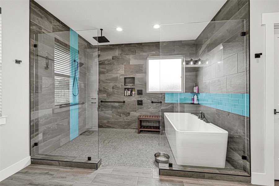 Primary en-suite bath with walk-in shower and soaking tub