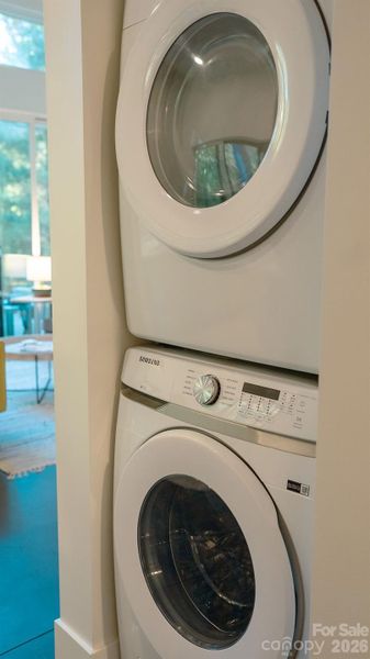 Stacked washer and dryer convey