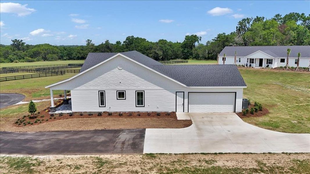 Front exterior of a new home in , Citra, FL, highlighting curb appeal (Image 26).