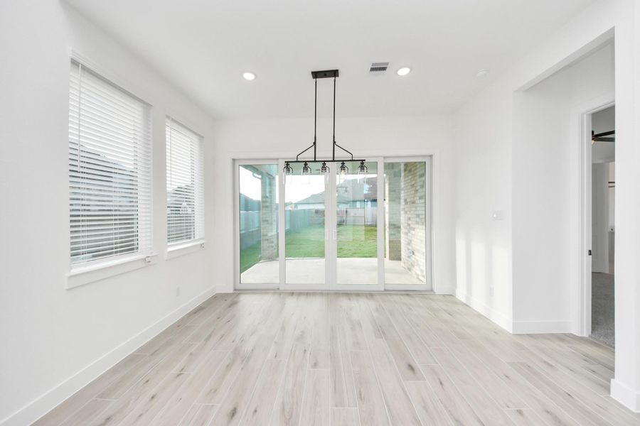 Sliding doors leads to the extended covered patio! Sliding doors leads to the extended covered patio!