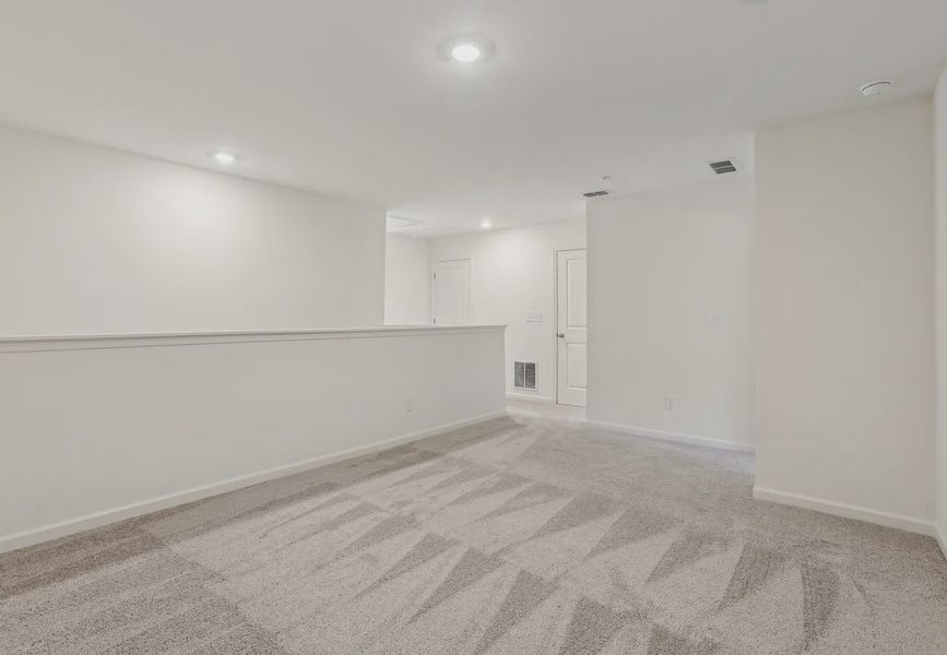 Representative unfurnished interior of a home built from the Echo by Starlight Homes in Hawks Run, Kissimmee (Image 5).