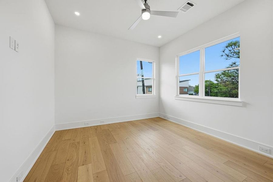 Secondary bedrooms (#1): The upper level features secondary bedrooms designed to mirror the home's primary suite in both quality and aesthetic. These bright, airy retreats provide the perfect balance of privacy and high-end comfort for family and guests alike.