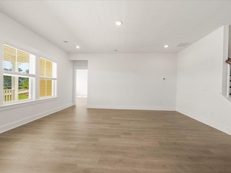 Spacious, unfurnished interior of a new home in The Coves at Lakes of Cane Bay II, Summerville (Image 11).