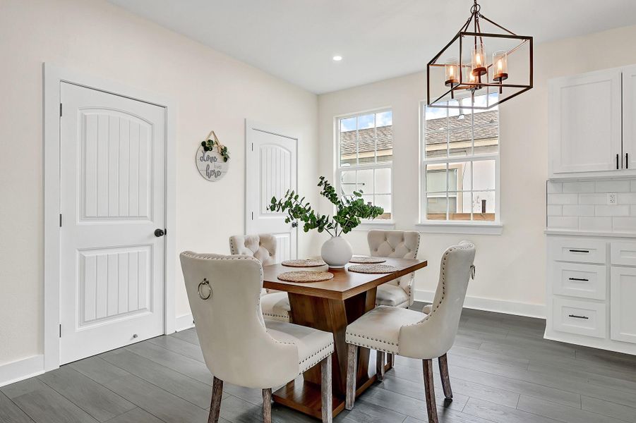 Bright and inviting dining area with abundant natural light. Bright and inviting dining area with abundant natural light.