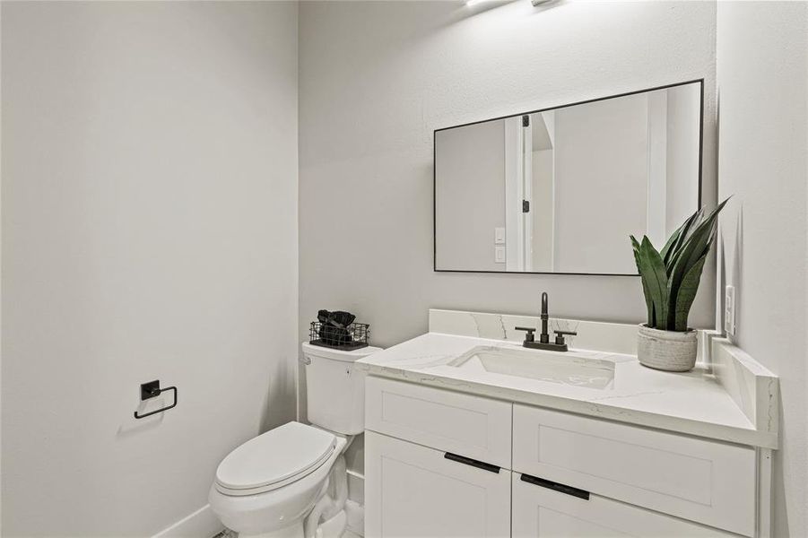 Bathroom featuring toilet and vanity