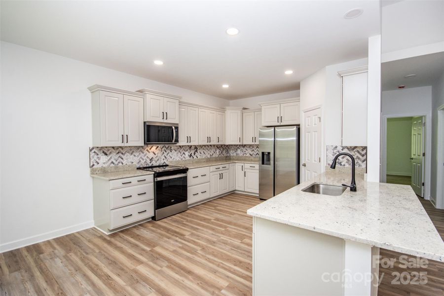 Furnished interior view inside a new home in , Statesville (Image 8).