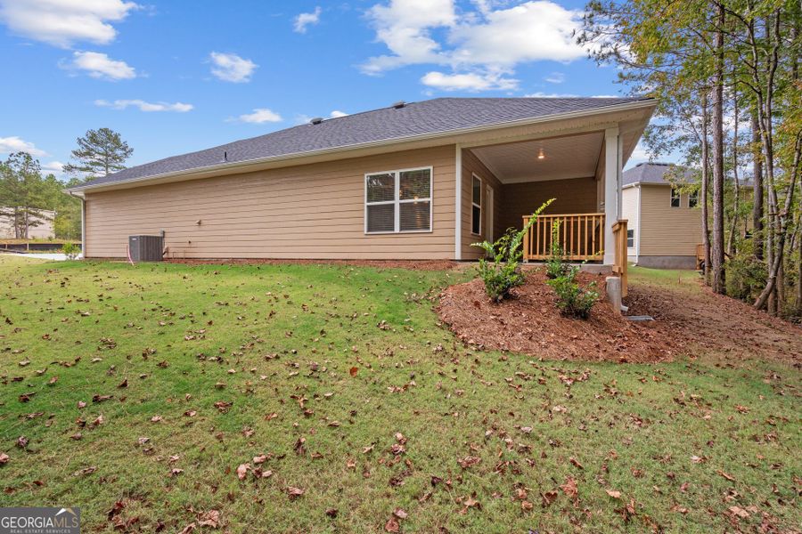 Exterior details and patio area of a home in Canterbury Villas, Carrollton (Image 15).