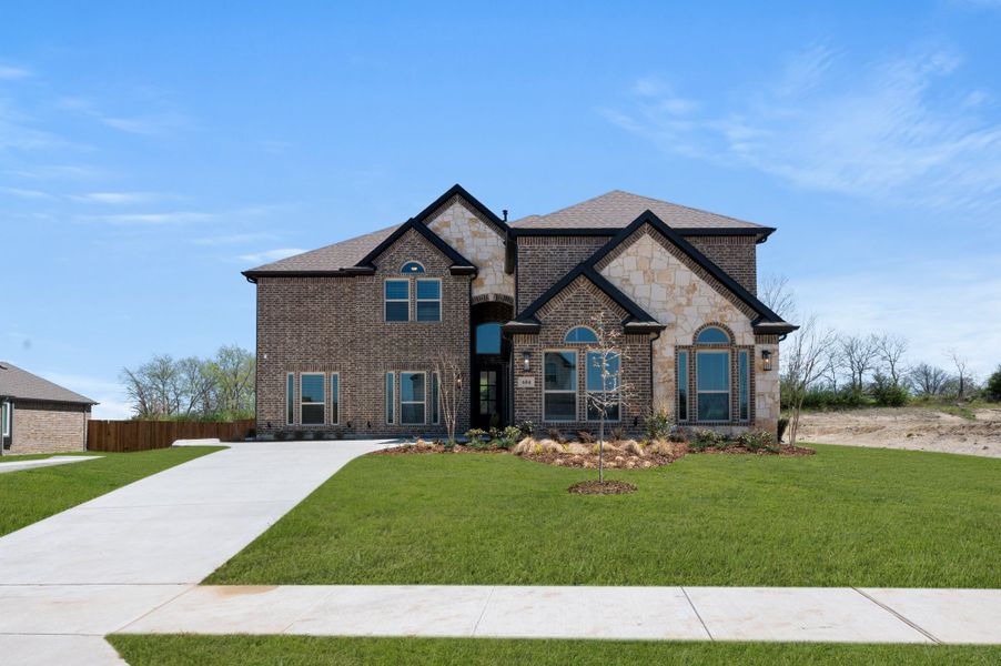 Front exterior of a new home in Hidden Lakes Estates, DeSoto, TX, highlighting curb appeal (Image 24). Front exterior of a new home in Hidden Lakes Estates, DeSoto, TX, highlighting curb appeal (Image 24).