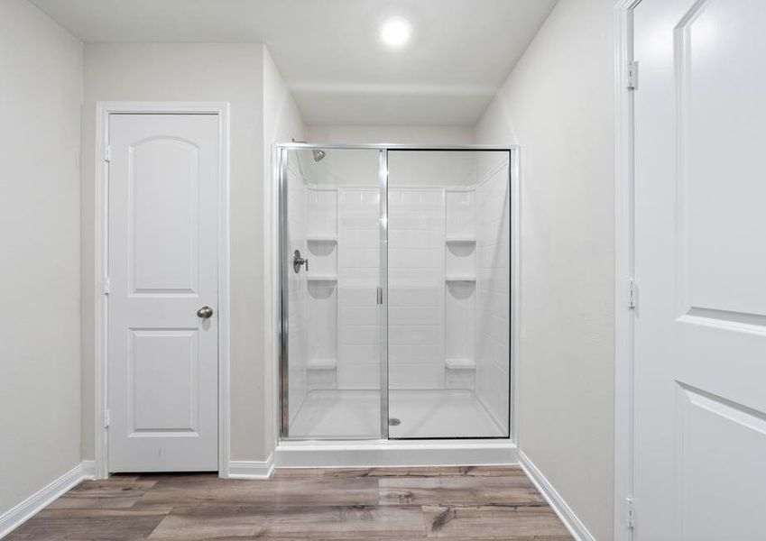 The master bathroom has a glass, walk-in shower.