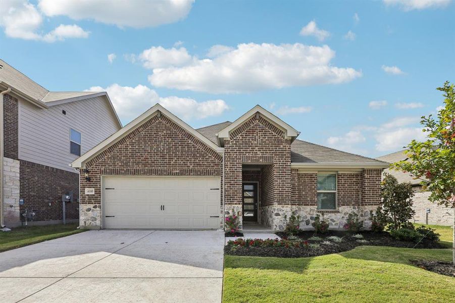 Front exterior of a new home in Lakehaven - Signature Series, Farmersville, TX, highlighting curb appeal (Image 2). Front exterior of a new home in Lakehaven - Signature Series, Farmersville, TX, highlighting curb appeal (Image 2).