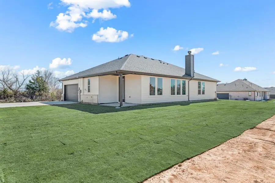 Exterior details and patio area of a home in Saddleback Estates, Boyd (Image 3). Exterior details and patio area of a home in Saddleback Estates, Boyd (Image 3).