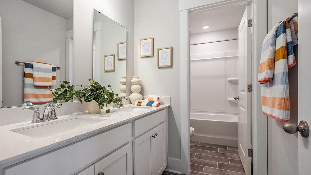 Representative furnished interior of a home built from the HARBOR OAK by D.R. Horton in The Forest at Black Bear, Longs (Image 16).