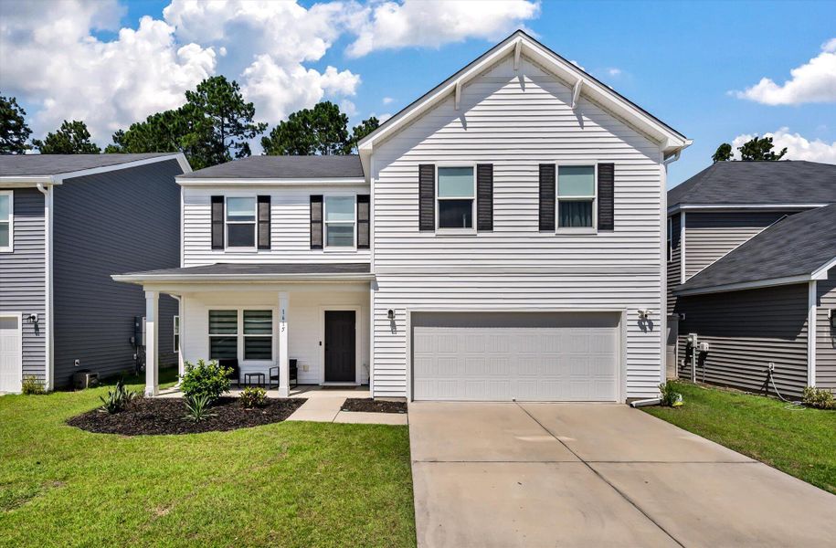 Front exterior of a new home in , Charleston, SC, highlighting curb appeal (Image 22).