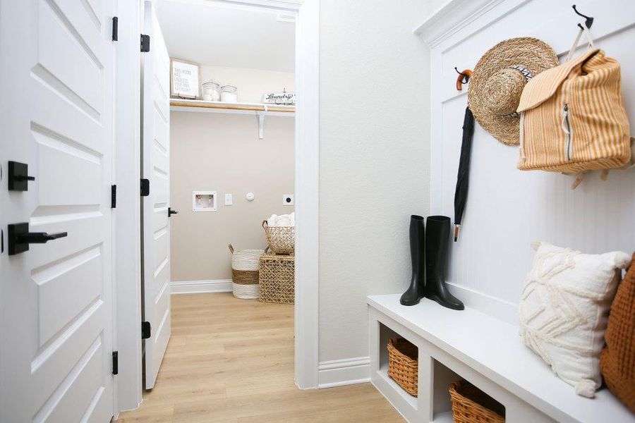 Mud room and laundry room off garage Representative photo