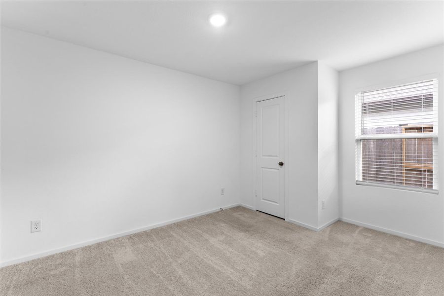 Another secondary bedroom with a generously sized closet.