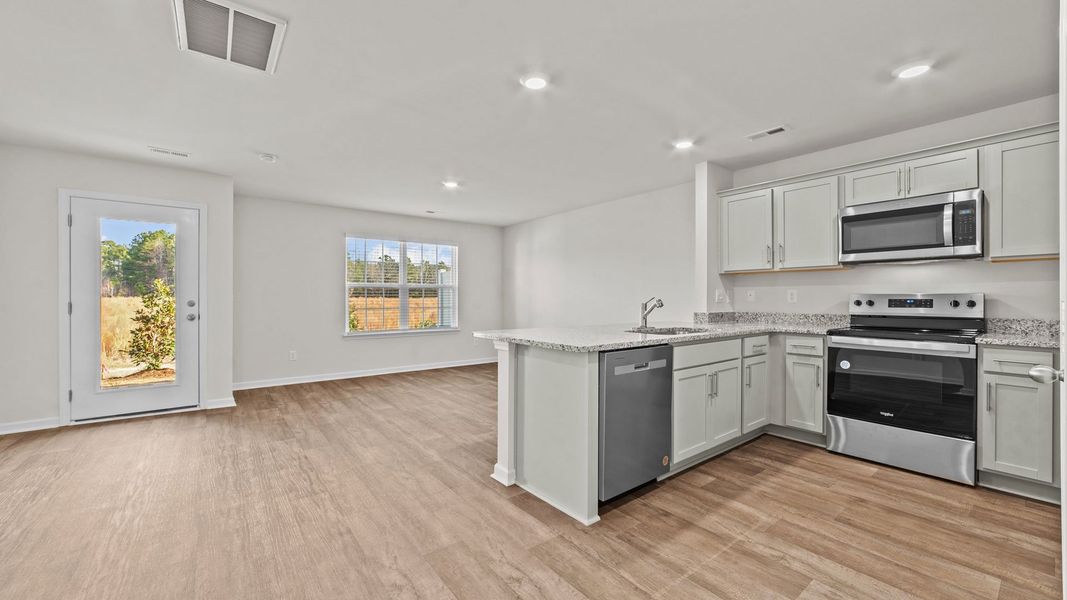 Representative furnished interior of a home built from the Pearson by D.R. Horton in The Townes at Carter Ridge, Greenville (Image 5).