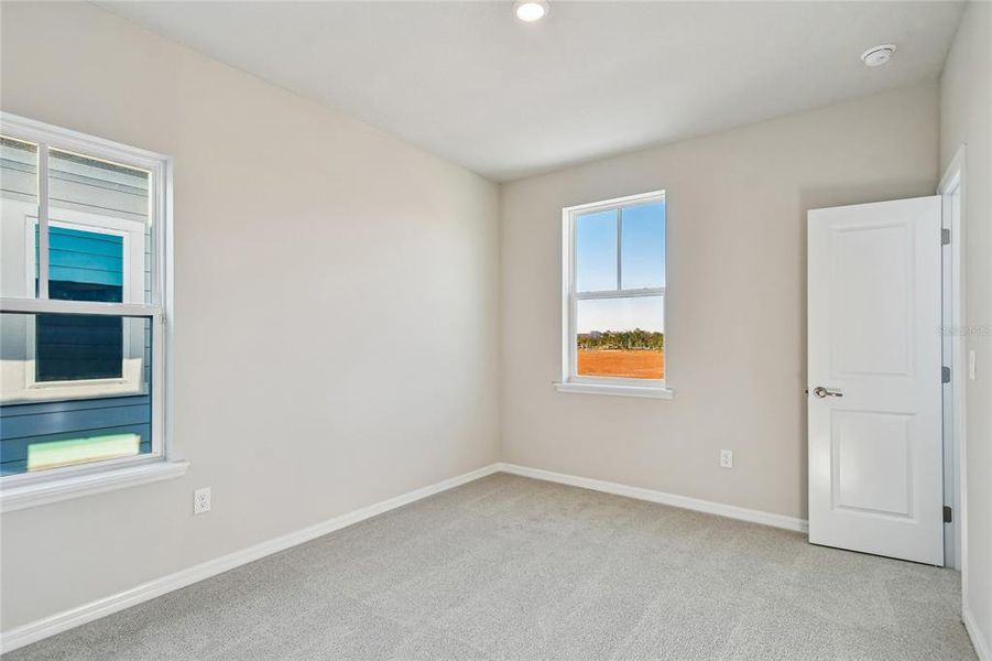 Spacious, unfurnished interior of a new home in Laureate Park at Lake Nona - Garden Series, Orlando (Image 28).