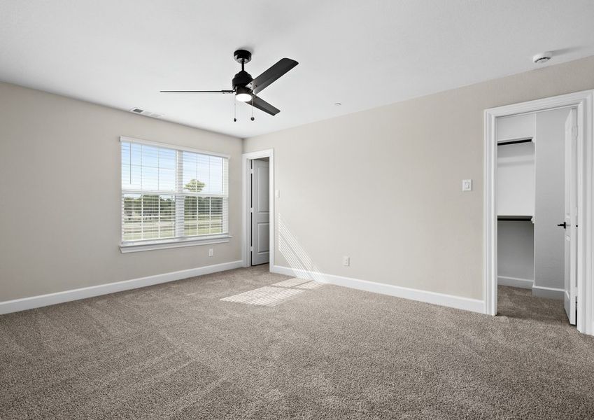 The master bedroom has large windows that let in great, natural light.