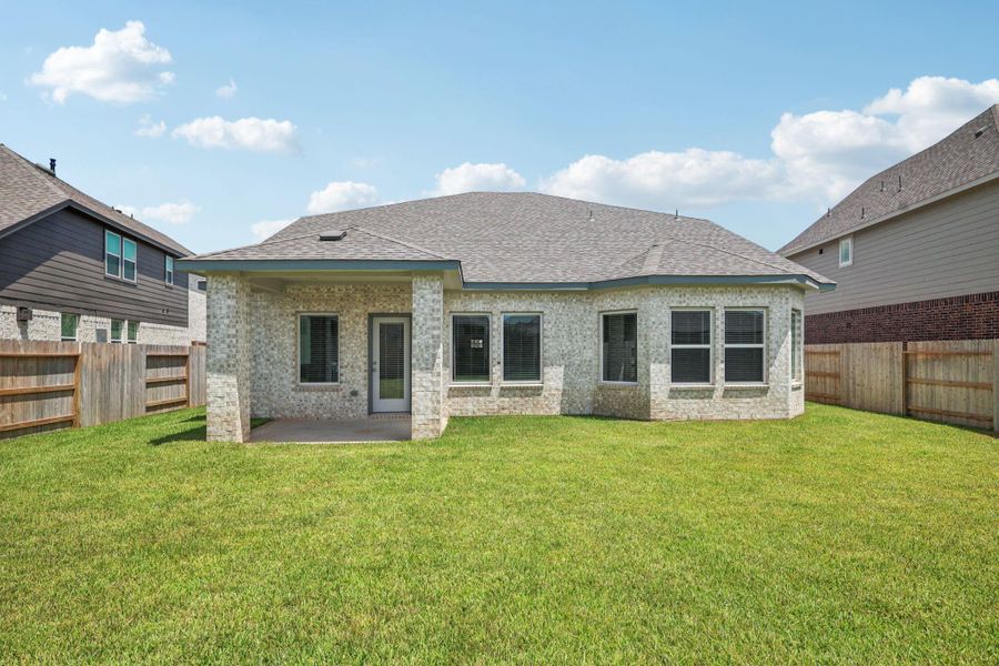Front exterior of a new home in Kingdom Heights, Rosenberg, TX, highlighting curb appeal (Image 26).