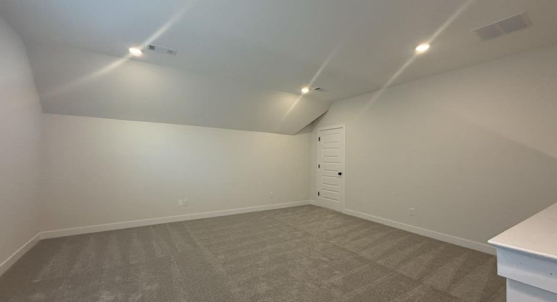 Bonus room featuring carpet flooring, lofted ceiling, and recessed lighting
