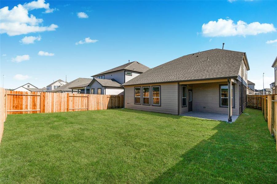 Come and see this spacious backyard with its beautiful covered patio. There is plenty ofroom for the kids to play and adults to relax. Perfect for your outdoor living space, patiofurniture, bbq pit, and so much more. The possibilities are endless!