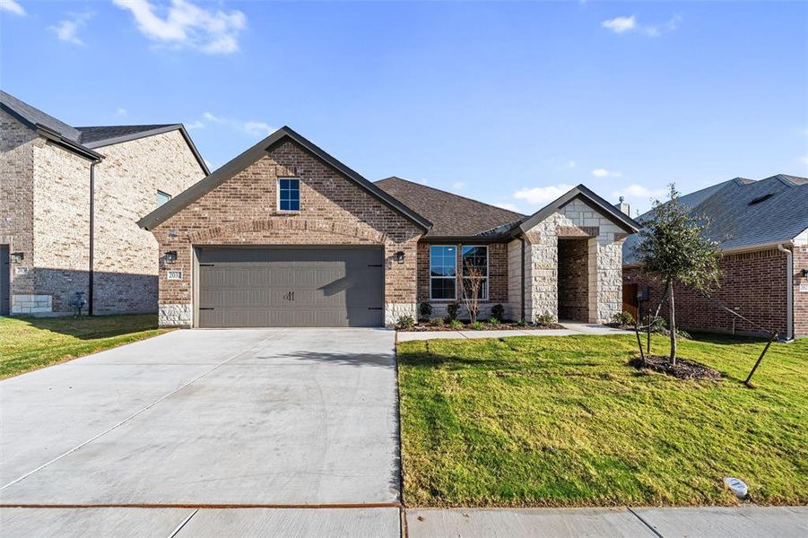 Front exterior of a new home in Northstar, Haslet, TX, highlighting curb appeal (Image 22). Front exterior of a new home in Northstar, Haslet, TX, highlighting curb appeal (Image 22).