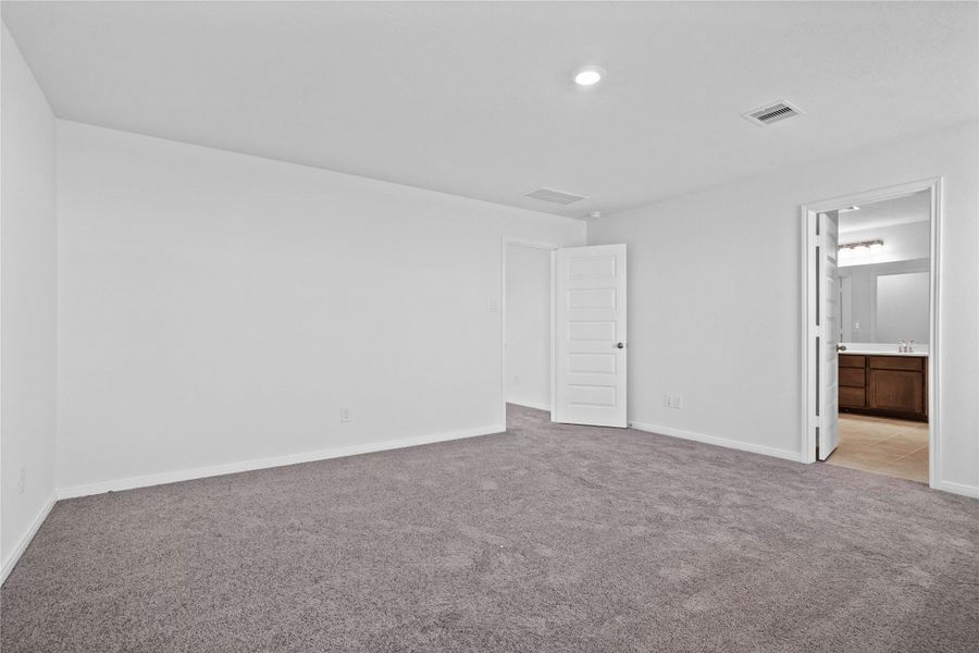 Additional view from primary bedroom to the primary bathroom.