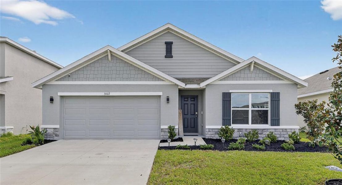 Front exterior of a new home in North Park Isle, Plant City, FL, highlighting curb appeal (Image 22).